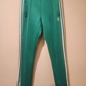 Adidas Women's Green Joggers with White Stripes